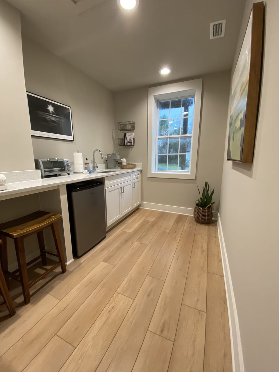 Kitchenette includes Keurig coffee maker, mini fridge, and other essentials.