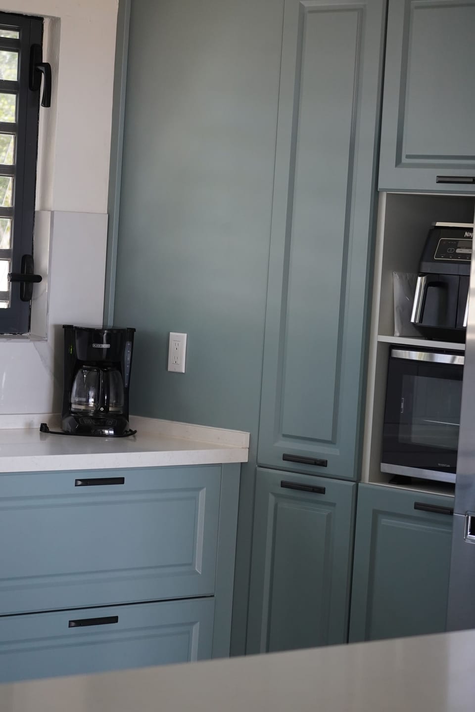 Kitchen stocked with small appliances.