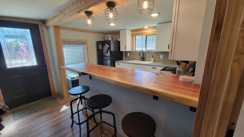 Have a seat at the live edge cedar bar