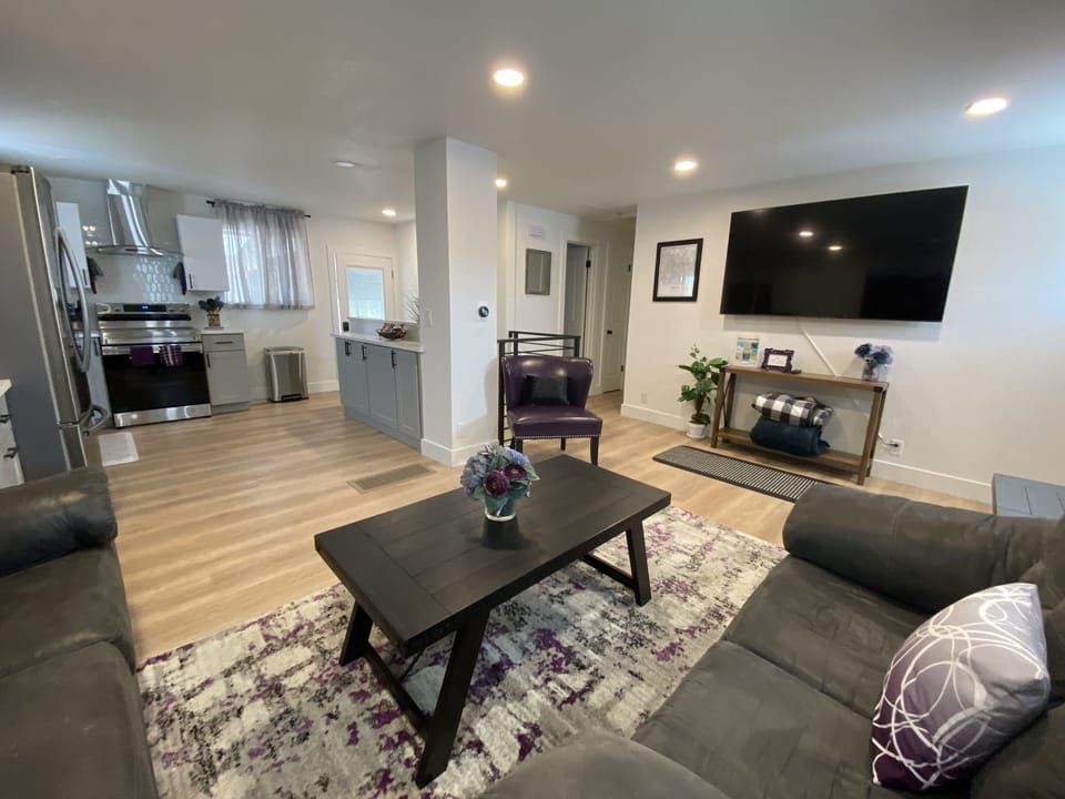 Main living room opening up to full kitchen