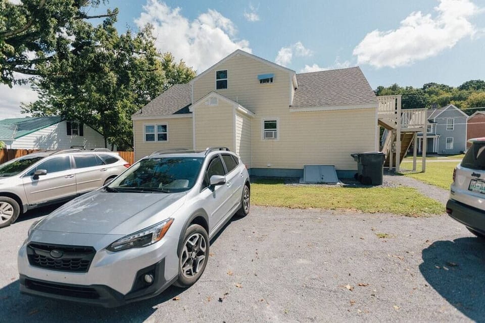 This is the parking area behind the apartments. Your unit is to the left of the house if you are coming in from the back.