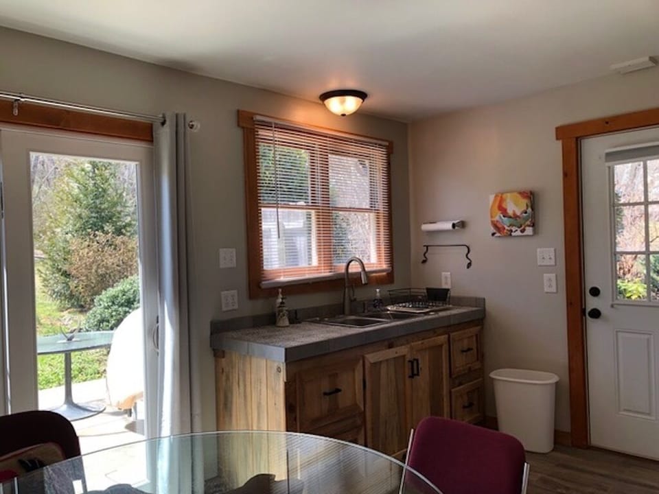 Custom made kitchen sink area and view to patio in back.
