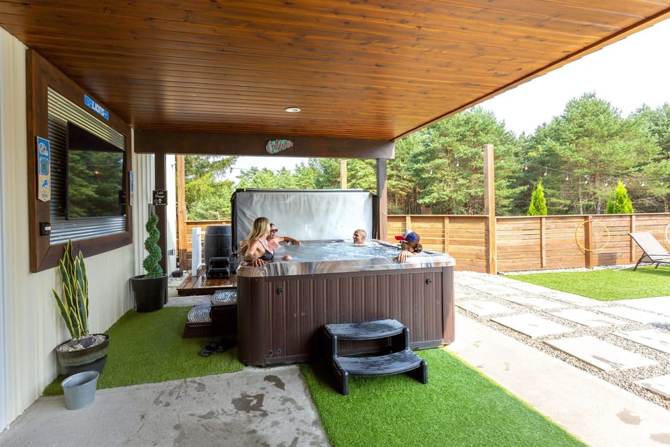 70's Lodge Pool House | Lounge Area | Changing Room | Work-out Equipment | Arcade Games | Indoor- Outdoor Smart TV's | Disco Lights | Radiant Heat | Dry Bar & Bar Stools | Refrigerator | Corn