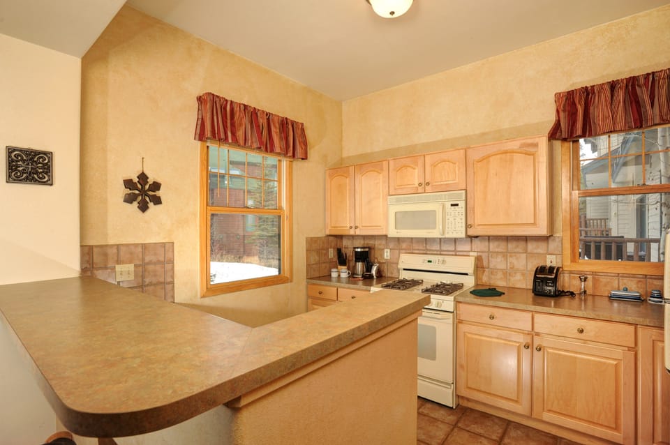The fully-equipped kitchen features lots of counter space
