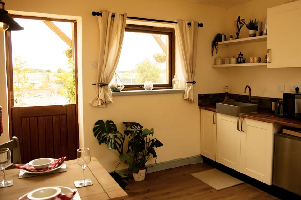 Authentic stable door looks out over our venue, with a kitchenette for preparing meals together