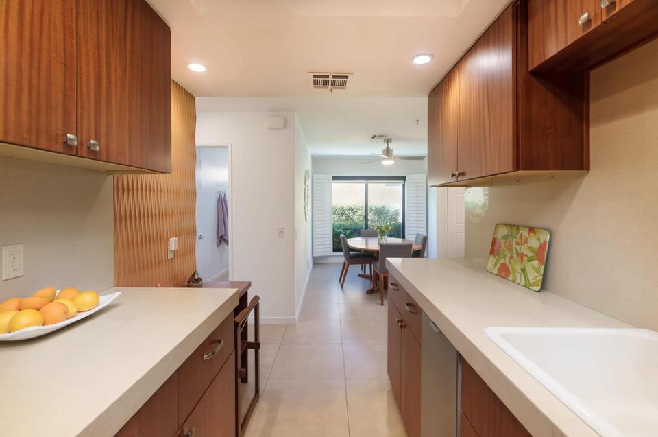 Step into a chef's paradise with this stylish, well-appointed modern kitchen. Featuring stainless steel appliances, sleek countertops, & ample cabinet space, it's the perfect space to cook & gather with family & friends, creating delicious memories!