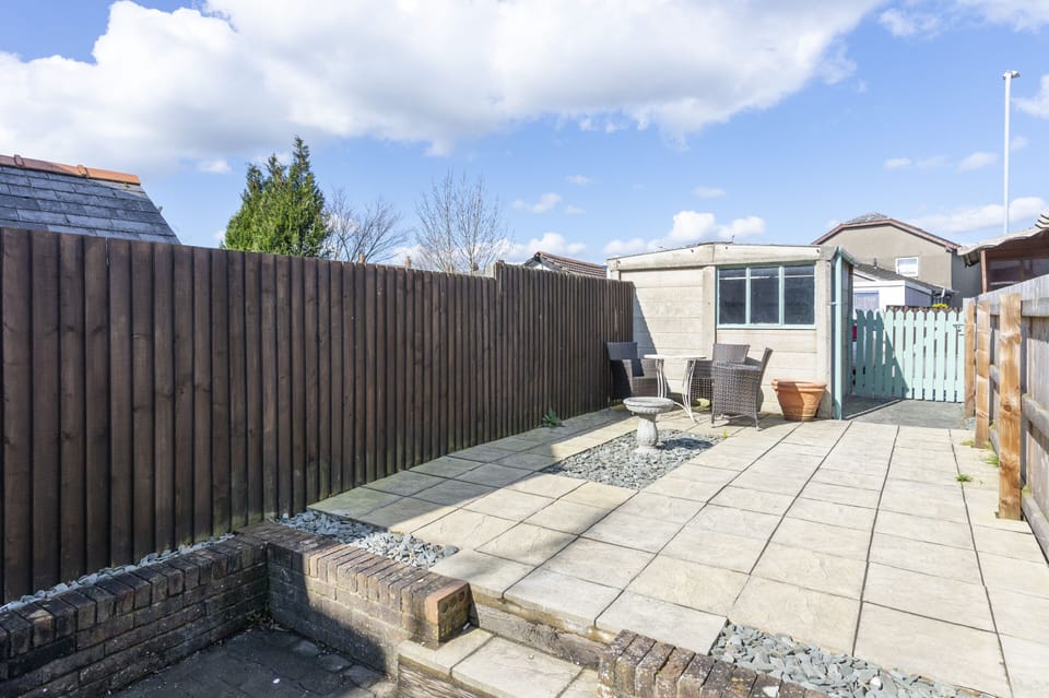 Outdoor area backing on to private off-street parking