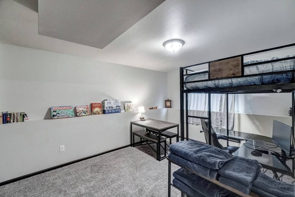 Lower level office/game room with loft bed for extra sleeping options.  
Office area features computer screen, keyboard and comfortable "gaming" chair.
Gaming area features multiple board games and novels for family entertainment!