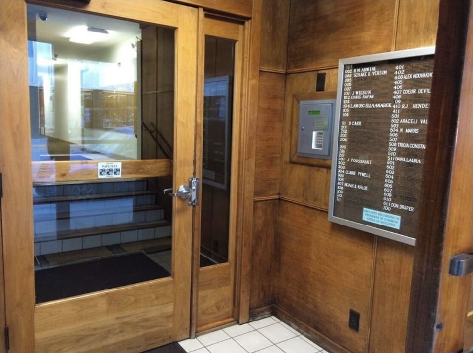 This door requires a security key, but I can buzz you in from my phone