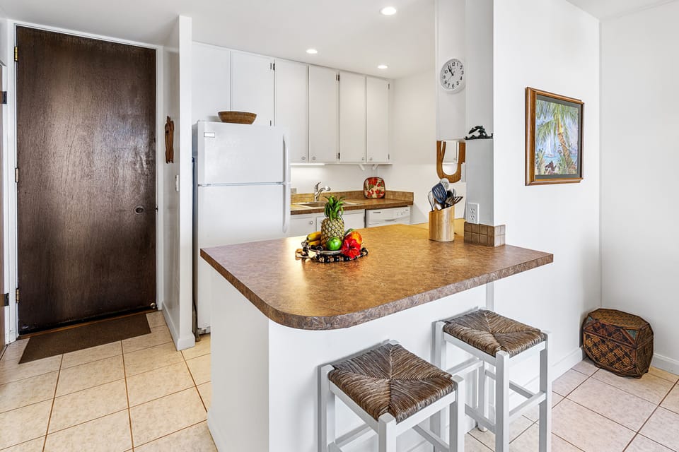 Beautiful kitchen! Condo decorated with a light, tropical style and thoughtful attention to detail.