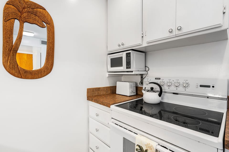 Tastefully updated kitchen with modern appliances and a fresh island-inspired style.