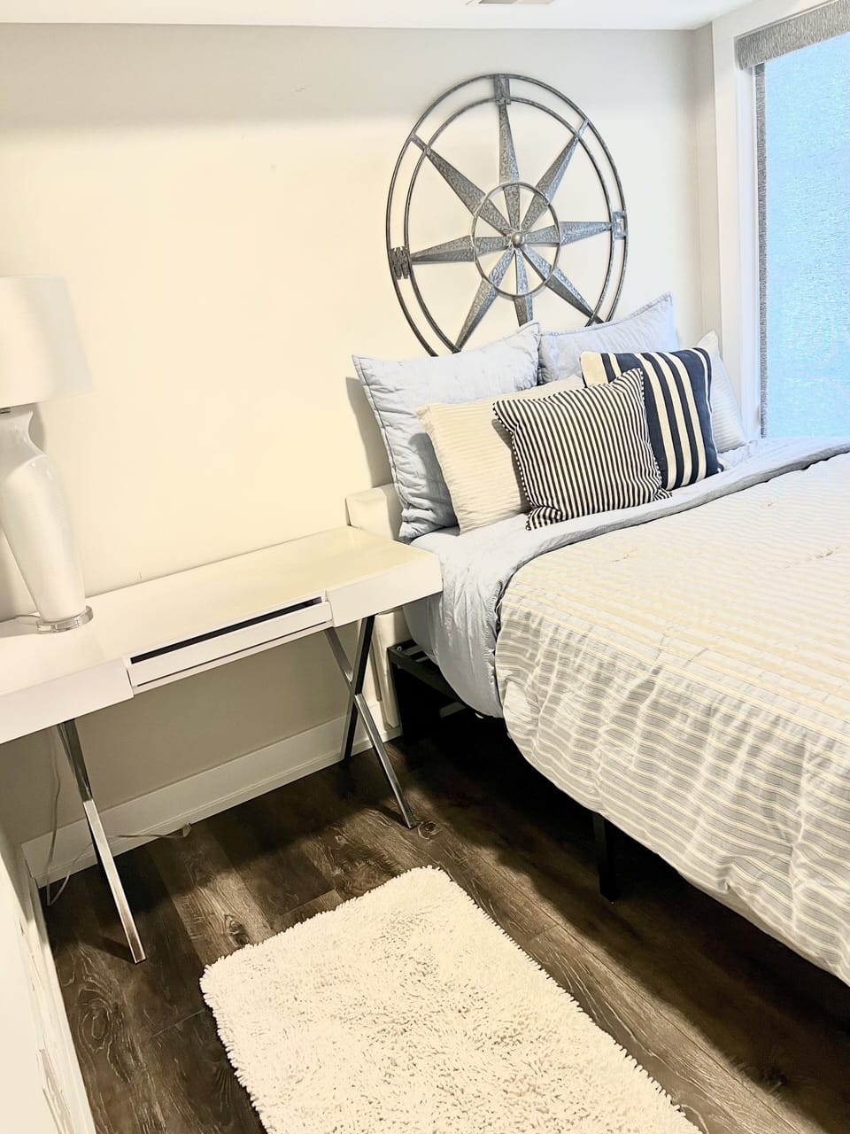 Bdrm #3  Queen bed. Small room with bed against wall. Full Bathroom in hall .