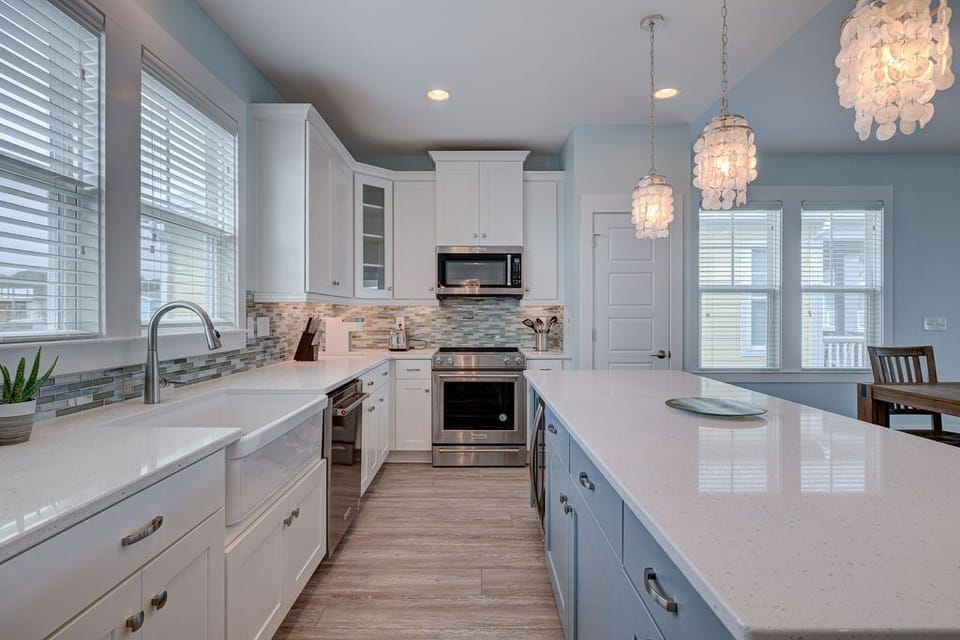 Custom high end light fixtures over kitchen island for great illumination. 