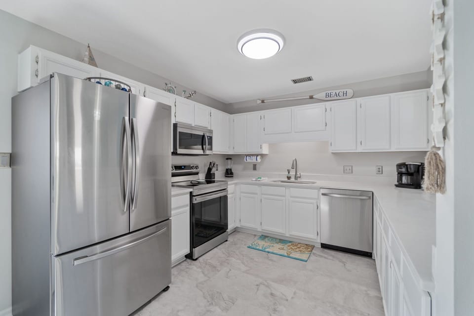 Kitchen fully stocked with modern appliances