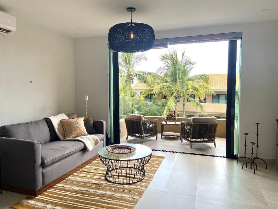 Studio overlooking pool with beach views