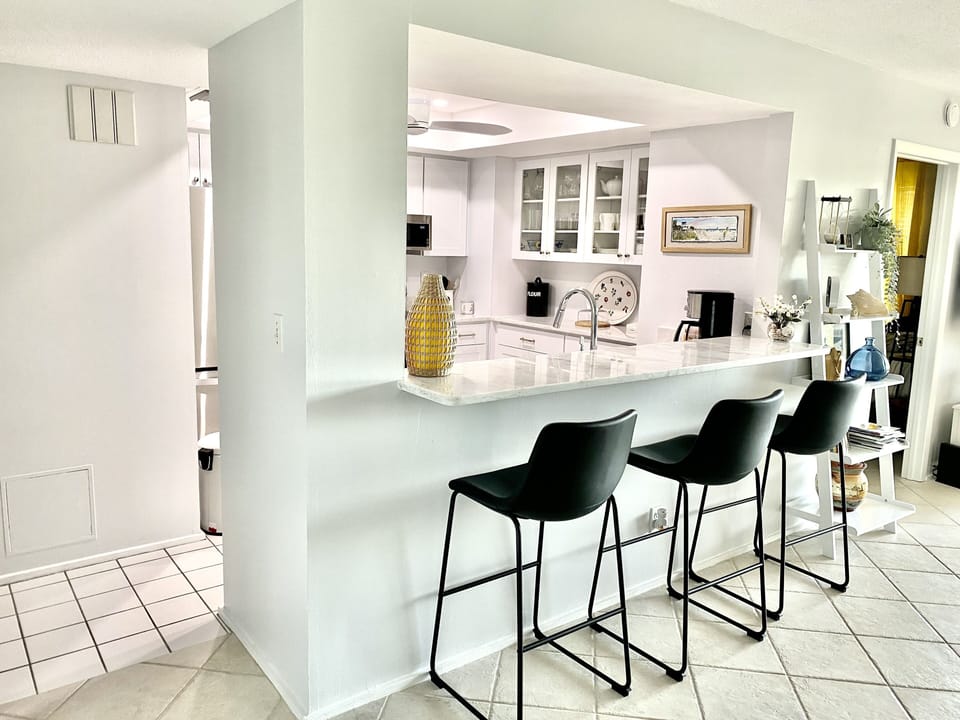 Completely renovated kitchen with stone counters and breakfast bar