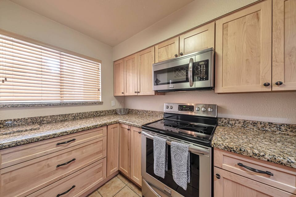 Kitchen with microwave, stove/oven, fridge, dishwasher, utensils etc