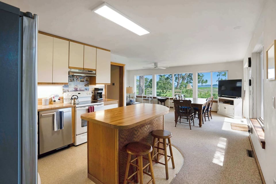 Kitchen flows seamlessly into dining and living areas