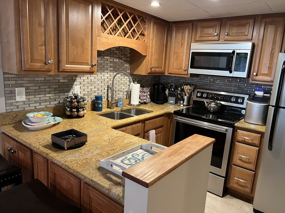 Wine storage rack, plenty of counter space and updated appliances. Well stocked!