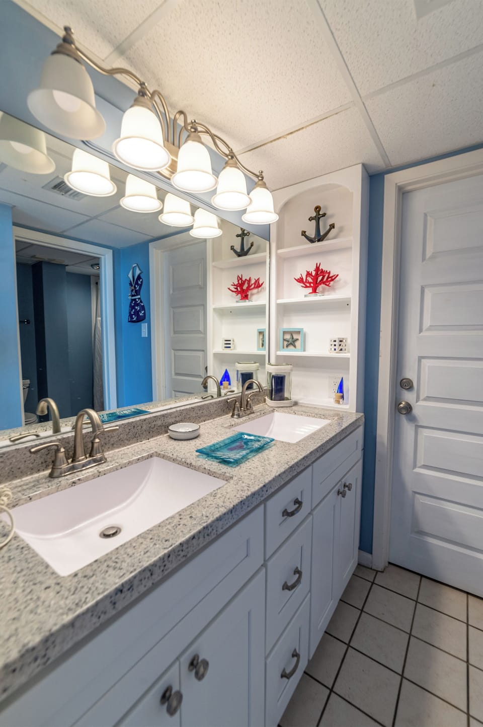 The Blue Ocean Main Bathroom has a separate dressing area with a double vanity and a separate room for the tiled walk-in shower