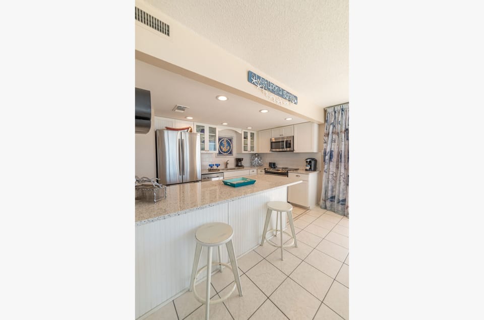 Additional seating at the kitchen bar.