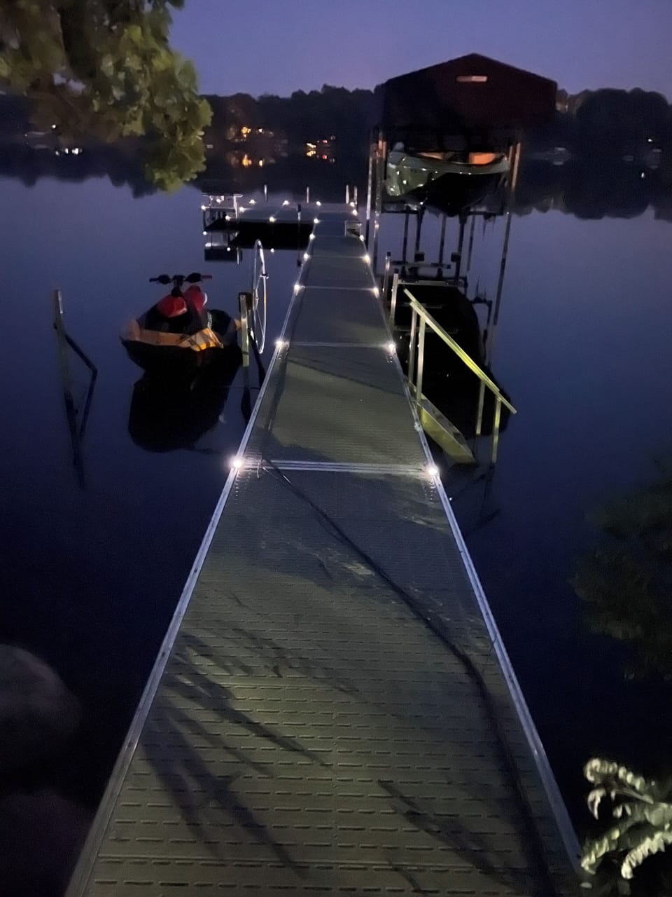 Lit dock at night. 