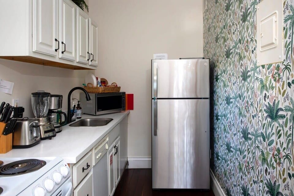 Paradise suite full kitchen with fridge, stove, over. dishwasher, microwave, blender, toaster, dinner & small plates, glasses, mugs, knives, silverware, utensils, pots, pans, coffee maker, hand soap, dish soap, paper towels, sponge