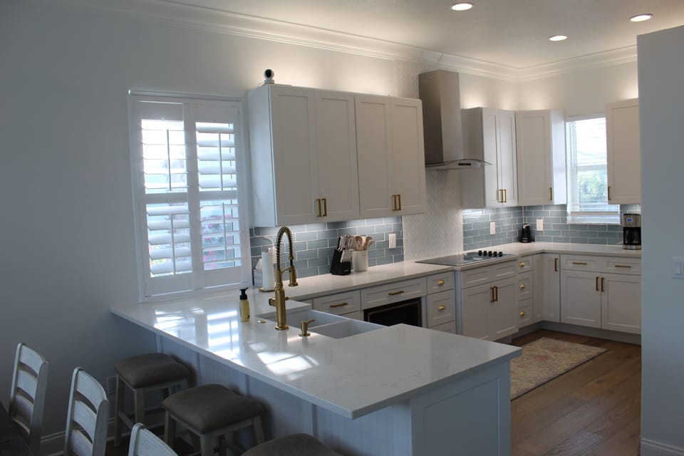 Stainless appliances incl double oven, refrigerator, dishwasher & microwave.  