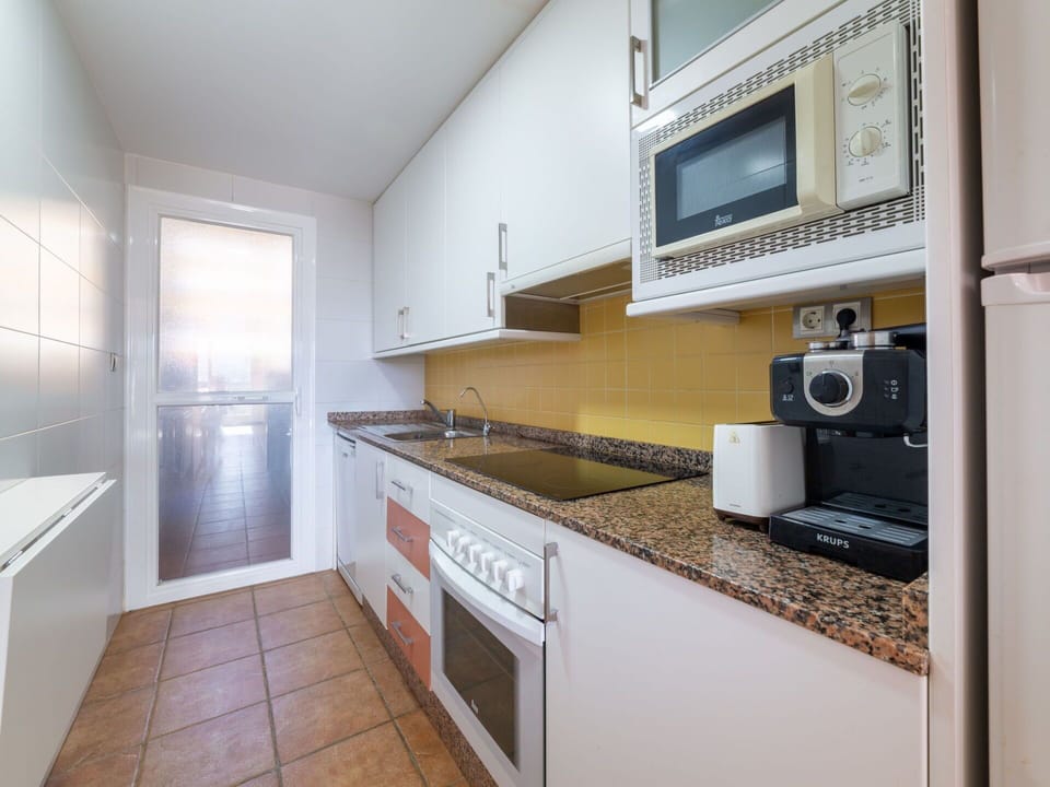 Cabinetry, Property, Furniture, Countertop, Sink, Kitchen Stove, Kitchen Appliance, Wood, Kitchen, Building