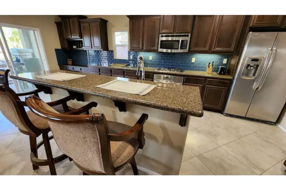 Bar stools counter and kitchen area
