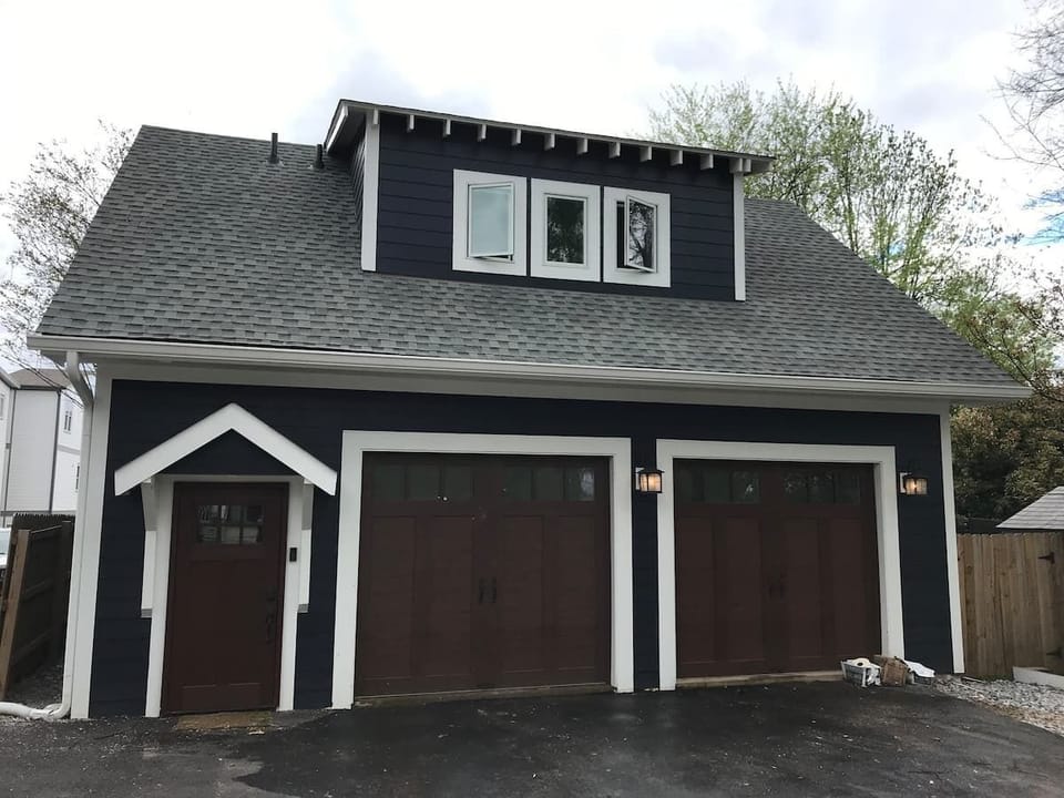 Our garage with private entrance to the carriage house to the left.