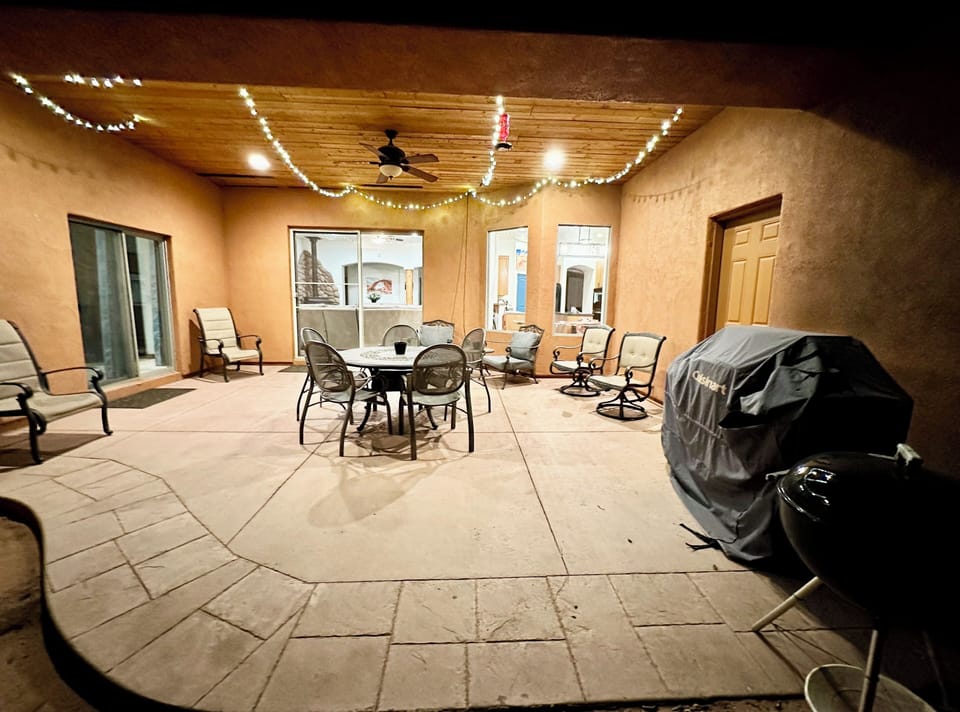 Covered patio, plenty of seating, bbq grill, charcoal grill available