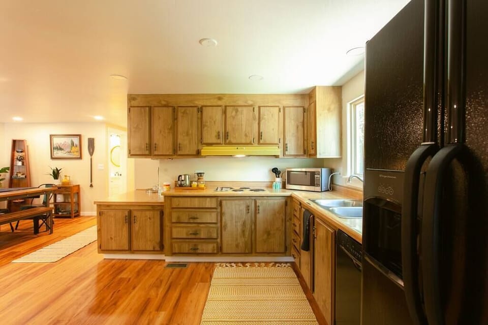 Bright, spacious kitchen with a sleek, wooden design that blends style and function.