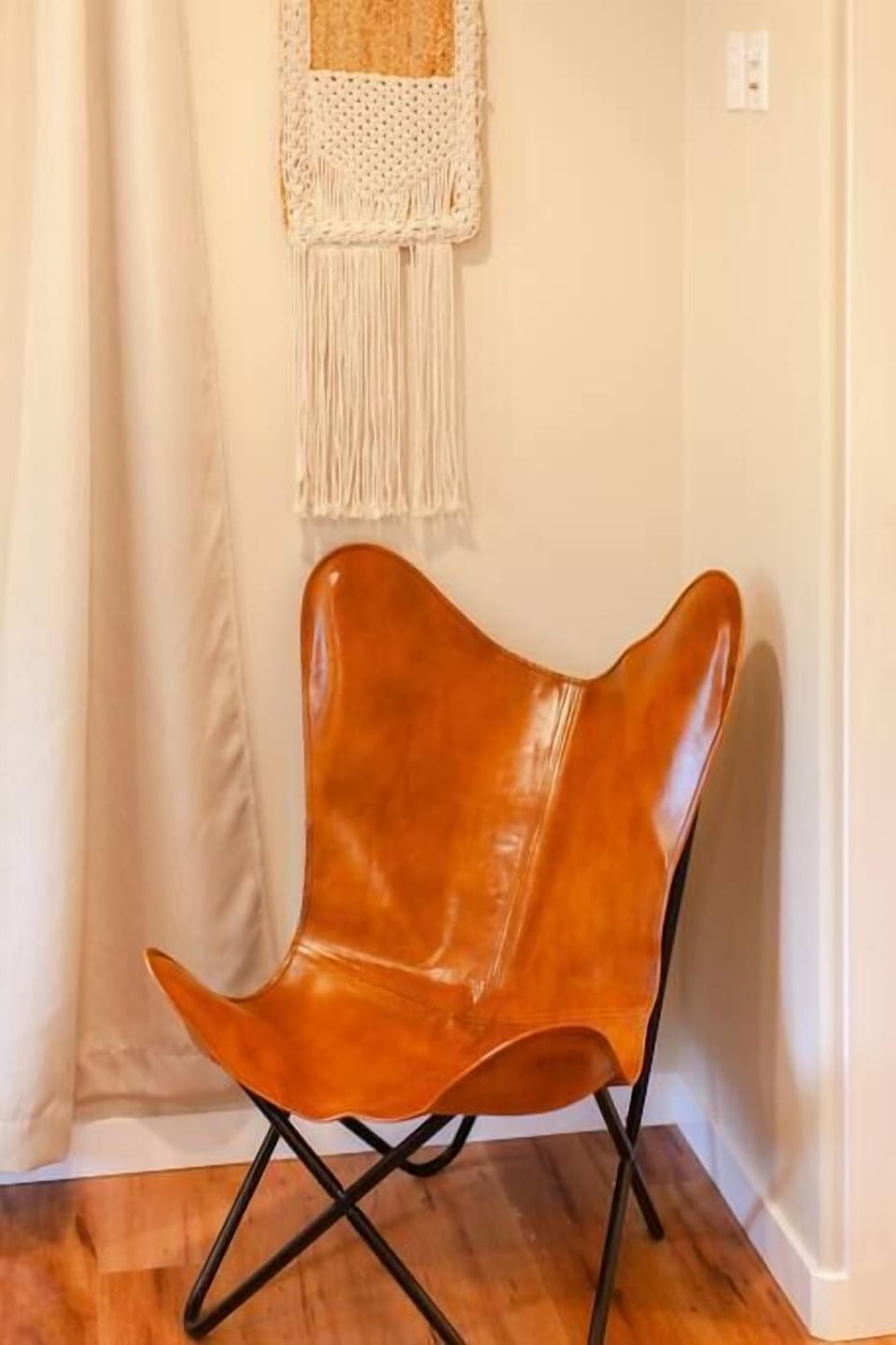 A bold, stylish leather chair ready for you to lounge in style.