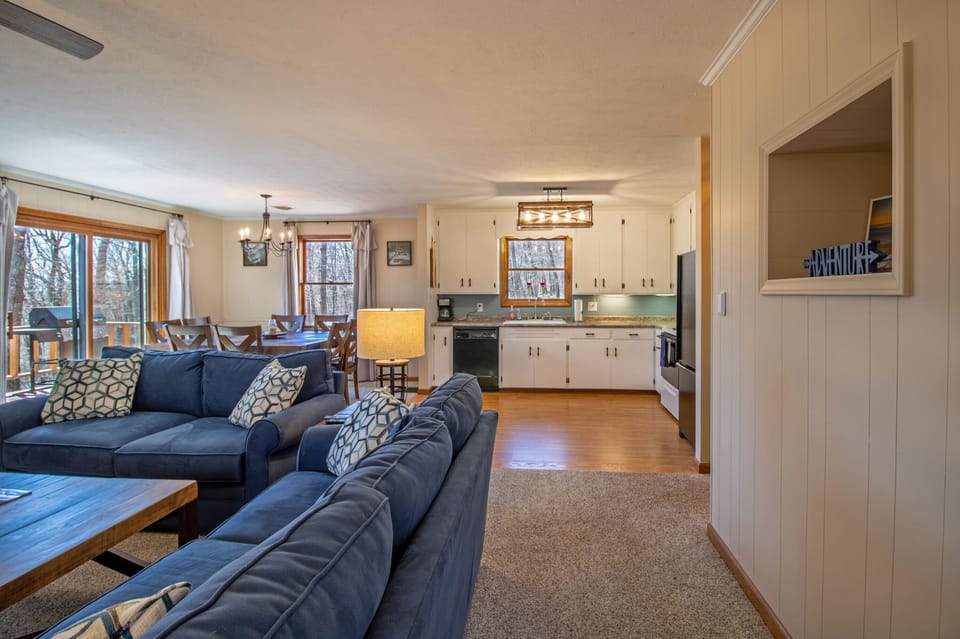 Living area, kitchen, and dining area on upper level