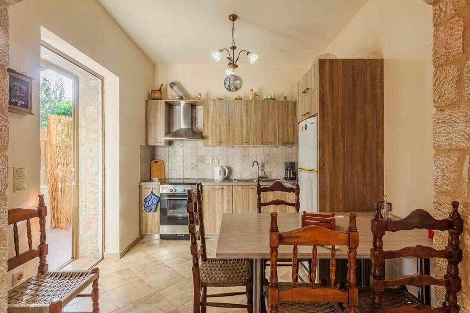 Immerse yourself in the distinct charm of the dining area and kitchen on the ground floor of the house