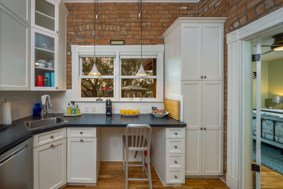 Kitchen with a desk for your computer.