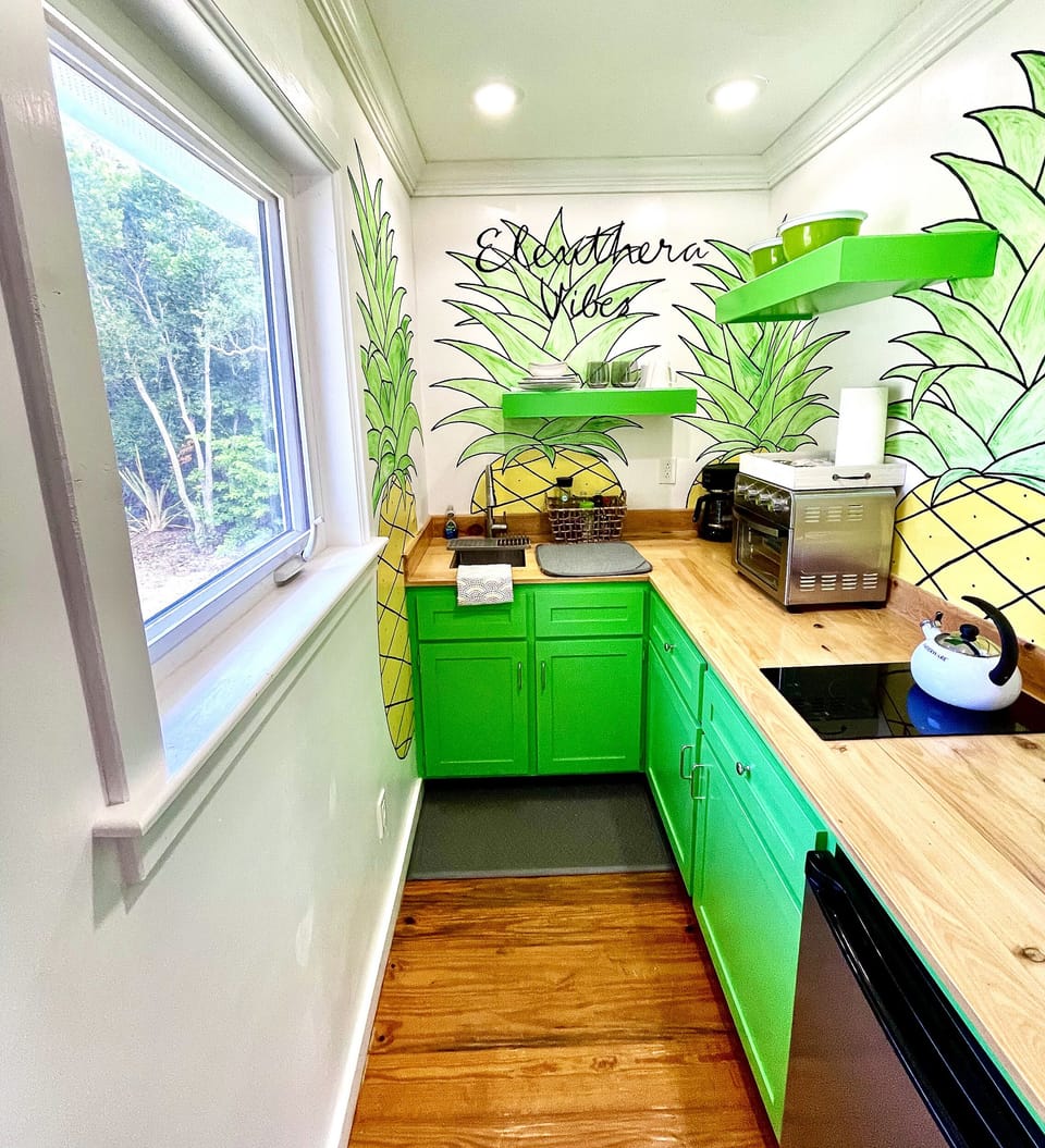 Funky groovy bright cheerful pineapple theme kitchen. Lots of stuff for cooking.