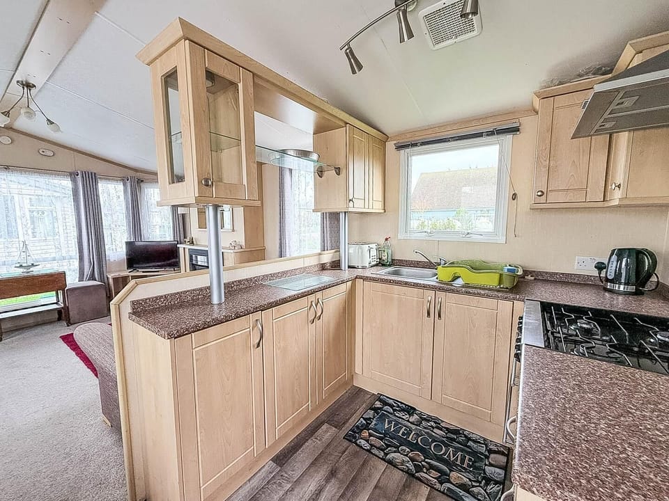 Bright, airy kitchen with modern appliances and scenic window views