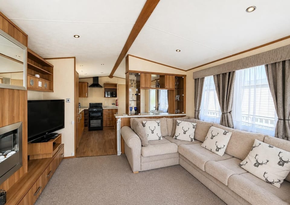 The caravan living area is perfect for quality time, board games, or simply putting your feet up with a cup of tea while recounting the day's adventures.