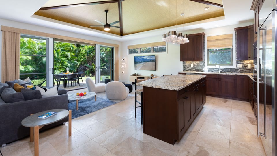 Open concept living area with slide open pocket doors to the lanai