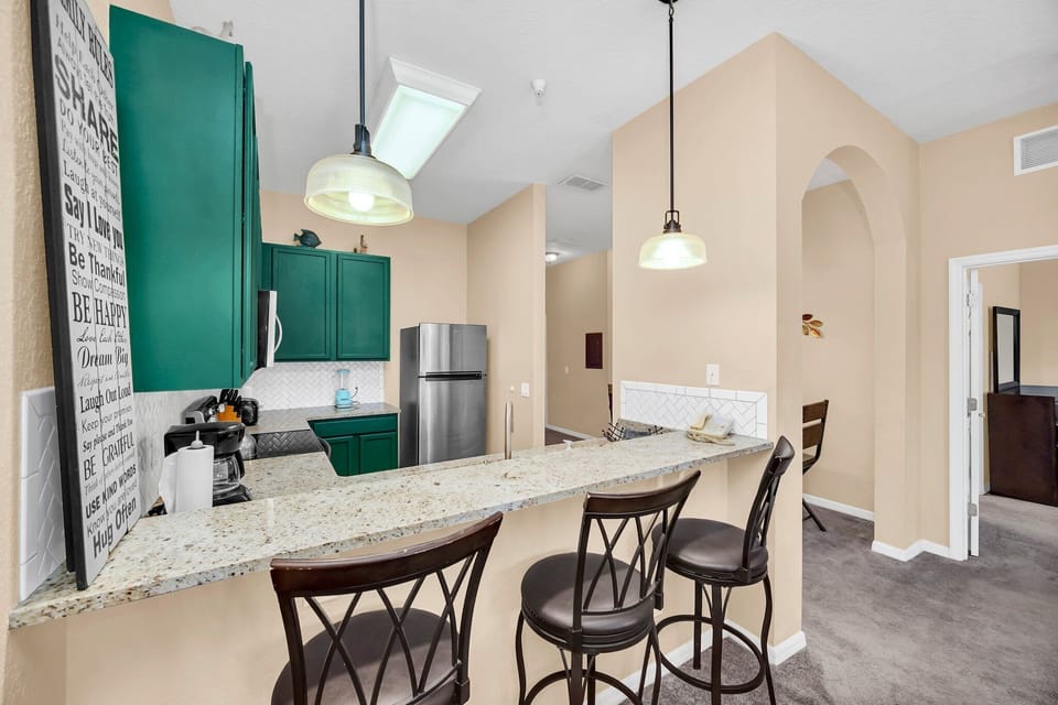 Gather around the breakfast bar, perfect for preparing meals, socializing, and family gatherings.