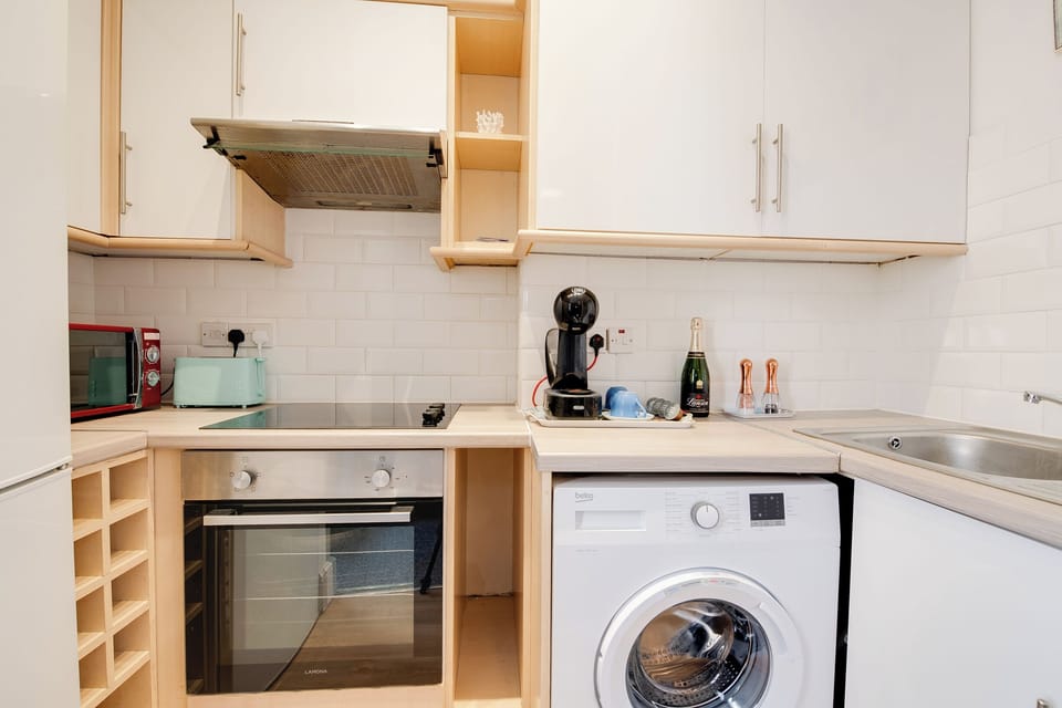 Kitchen: Whip up a feast in this stylish kitchen with modern appliances and charming decor!