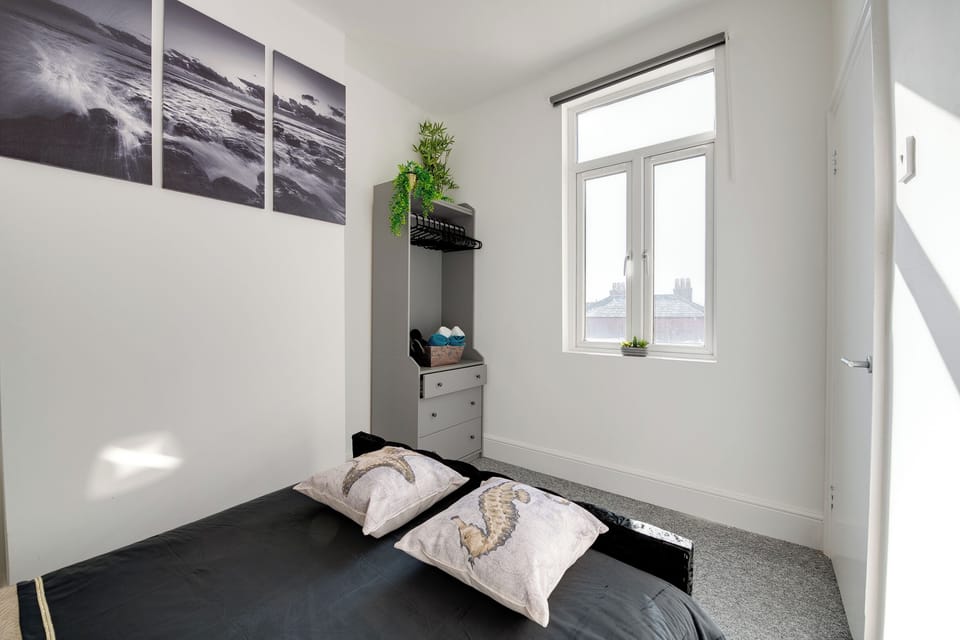 Bedroom: Bright and airy retreat with artistic ocean views and stylish décor awaits your stay!