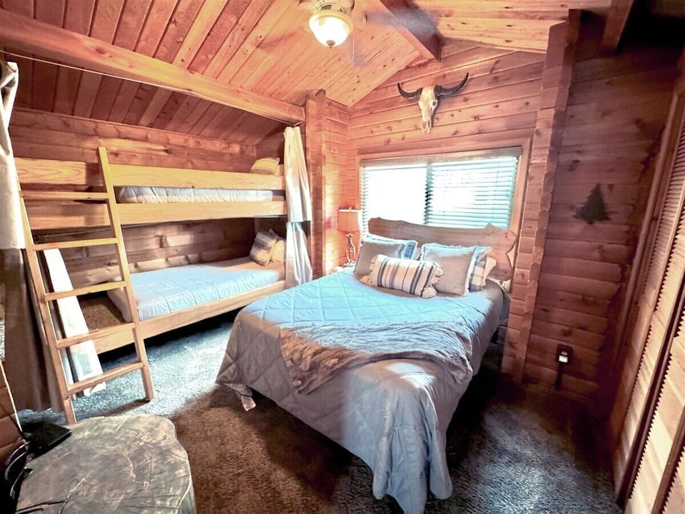 Bedroom 2 with queen bed, twin bunks, TV