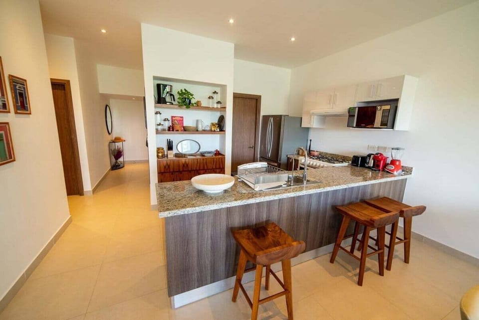 The kitchen is fully furnished and equipped with all you would need to feel at home, including a water softener and 2 coffee machines, one Dolce Gusto and one Filter Coffee.