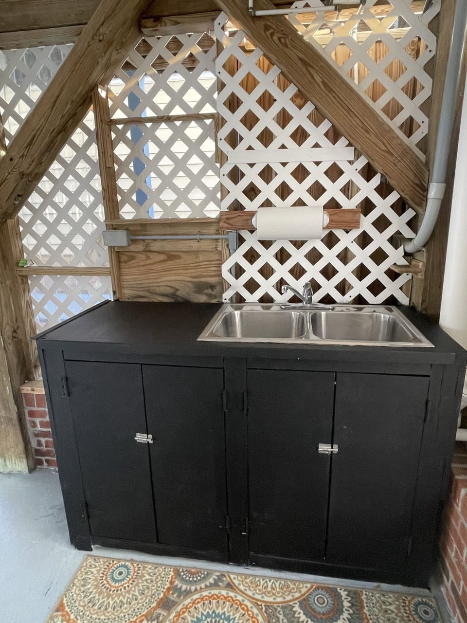hot/cold water sink located under the house