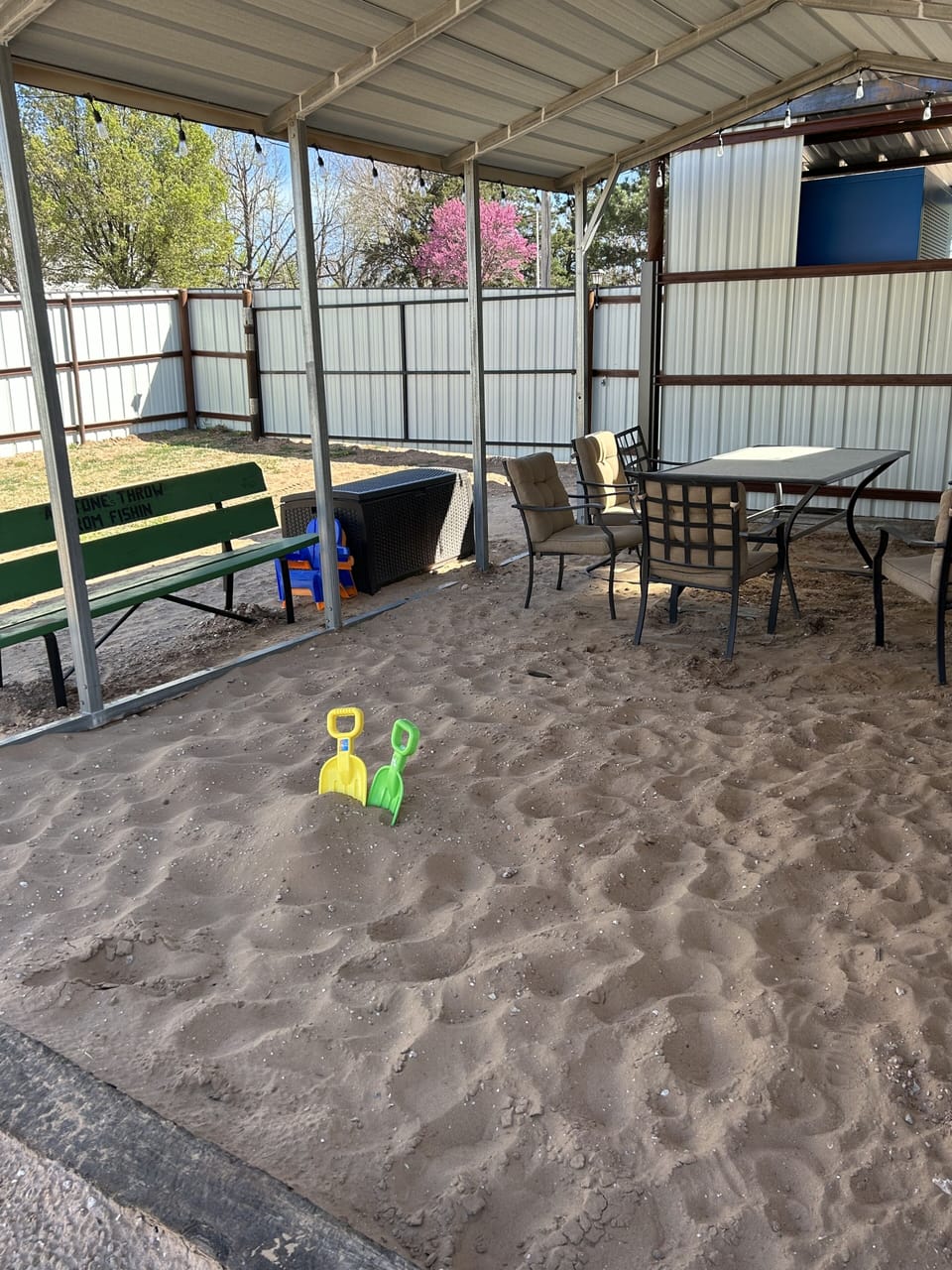 Commons Area - Sand Box with Sand Toys in the Toy Box.
