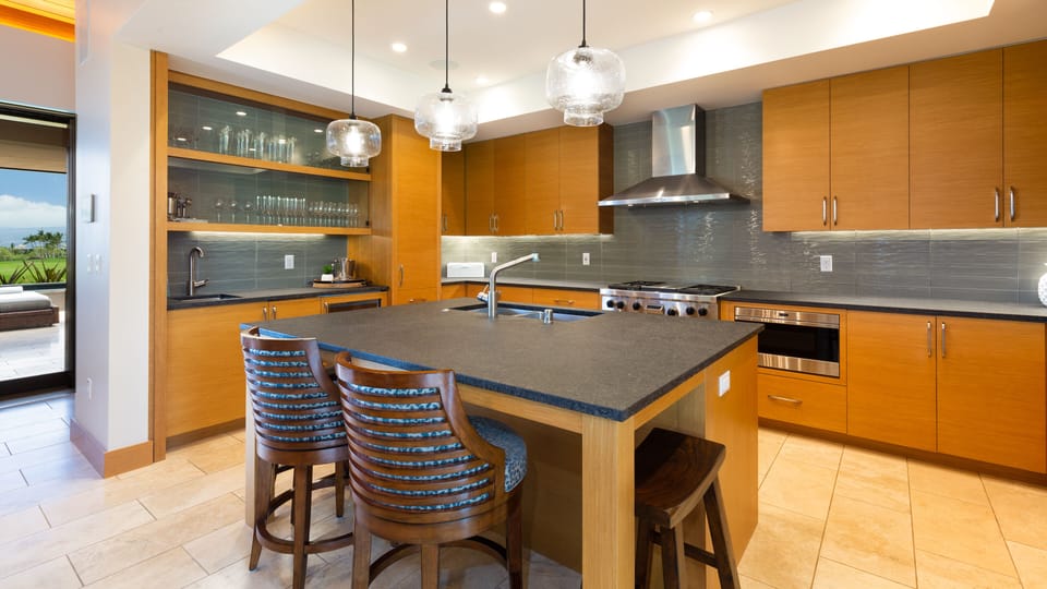 Gourmet kitchen stocked with cooking essentials, spices and oil