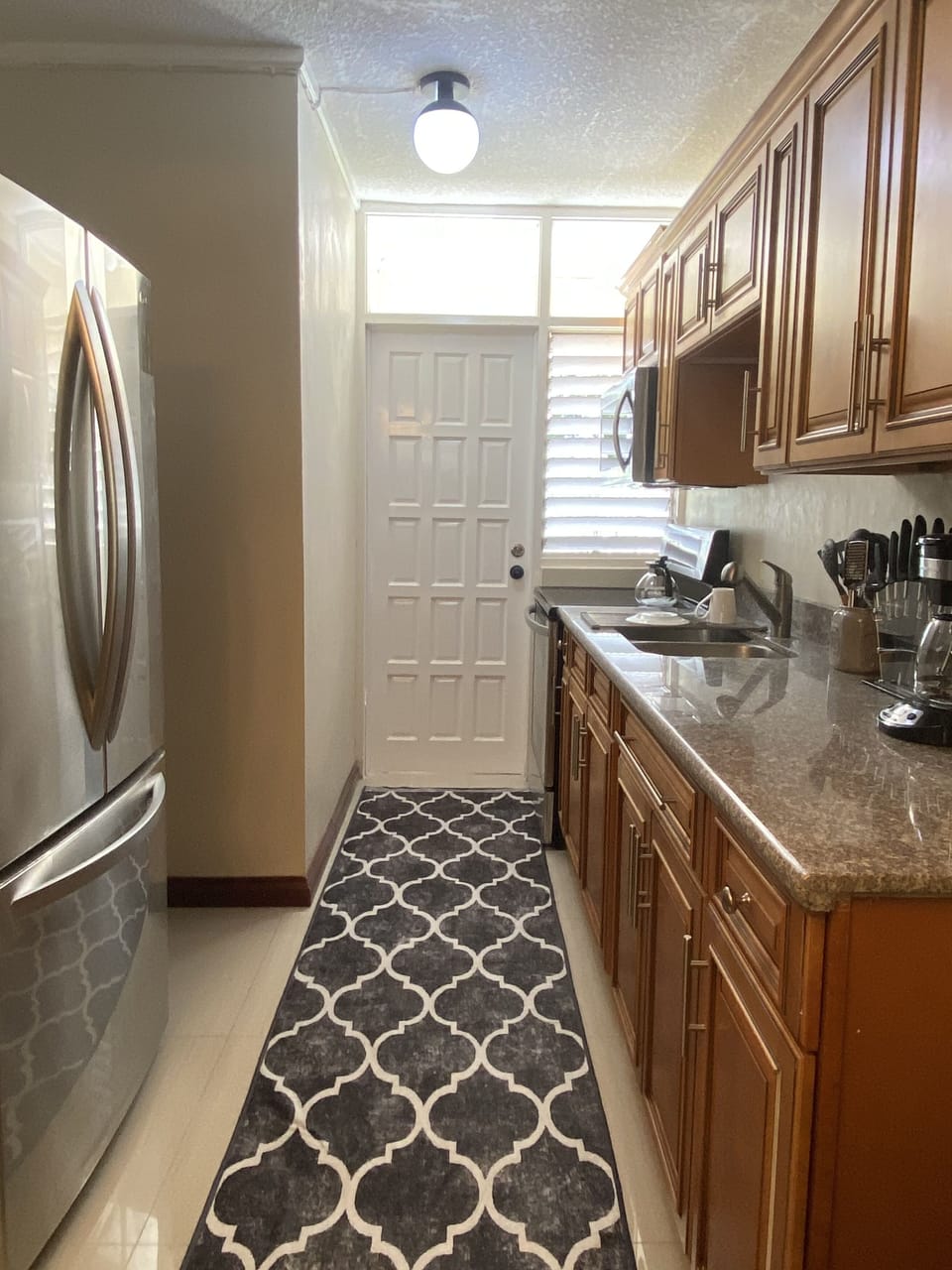 Stocked Kitchen with Utensils and Coffee Maker.  Spacious Refrigerator  